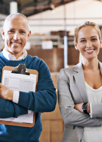 man and woman in a goods warehouse